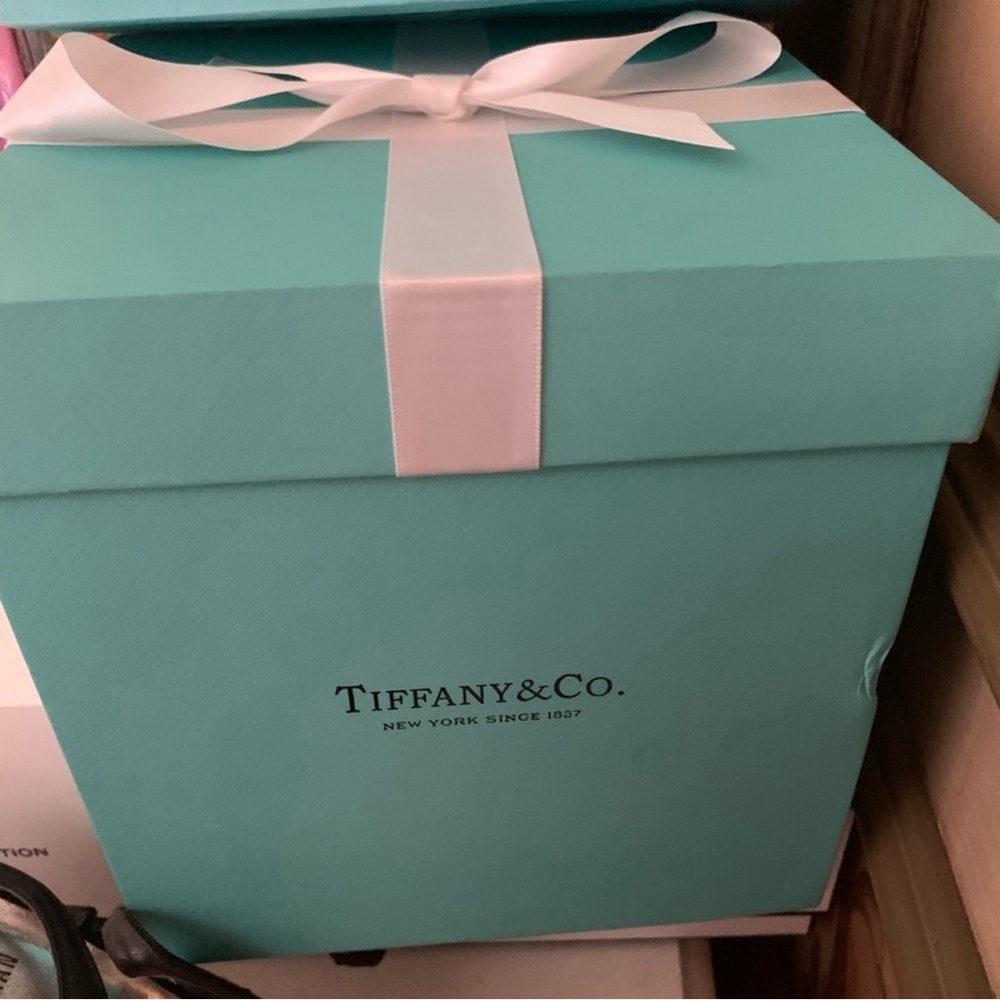 Large square Tiffany box with white ribbon.  Perfect size for a gift.